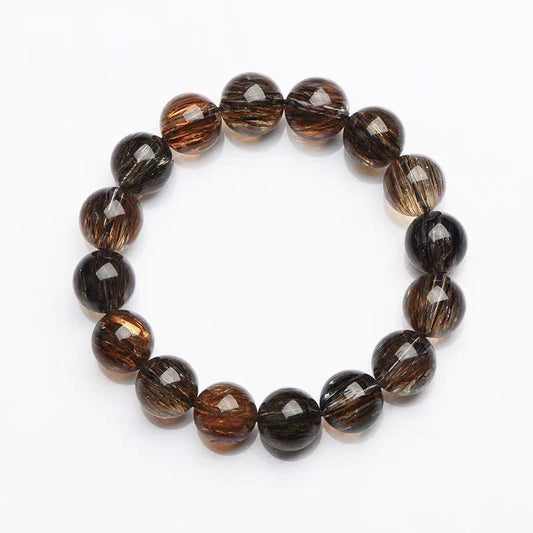 Beaded bracelet with brown and black beads on a white background
