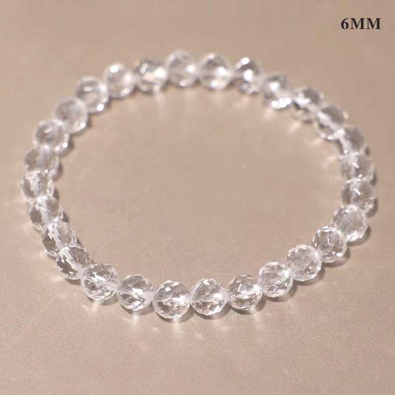 Clear beaded bracelet on a beige background with '6MM' text.