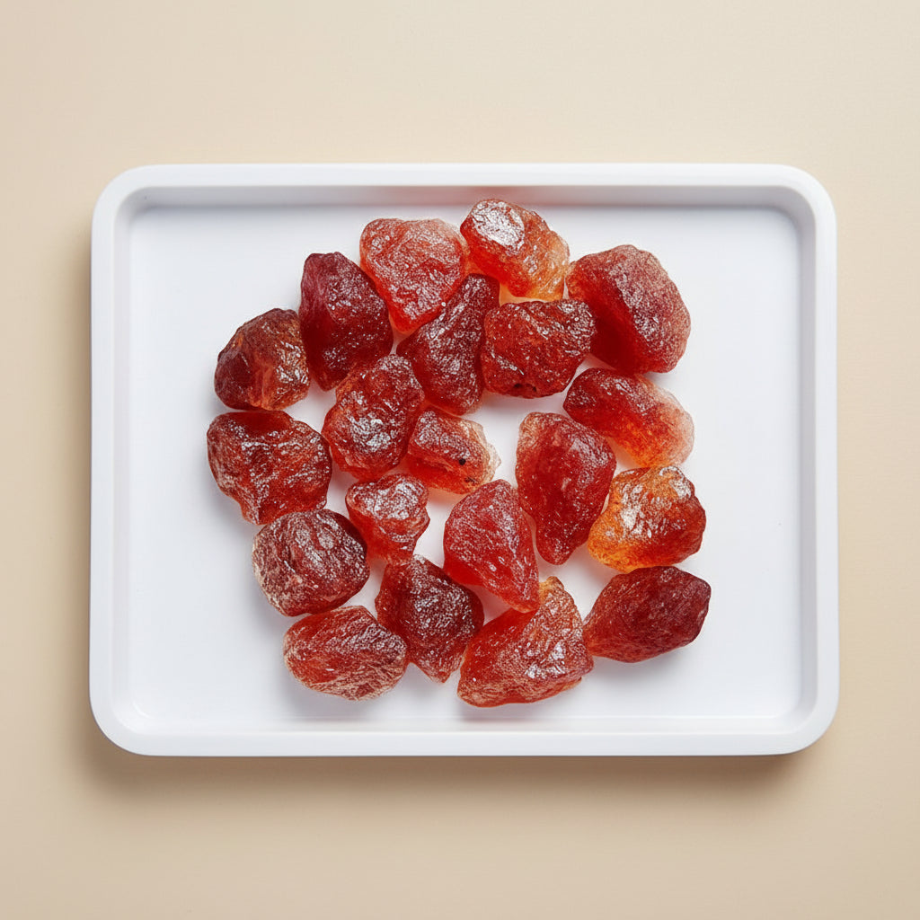 Red stone-like objects on a white background