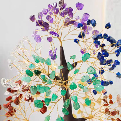 Decorative tree made of multicolored stones on a white background