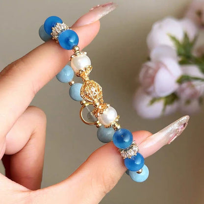 bue bracelet with gold accents