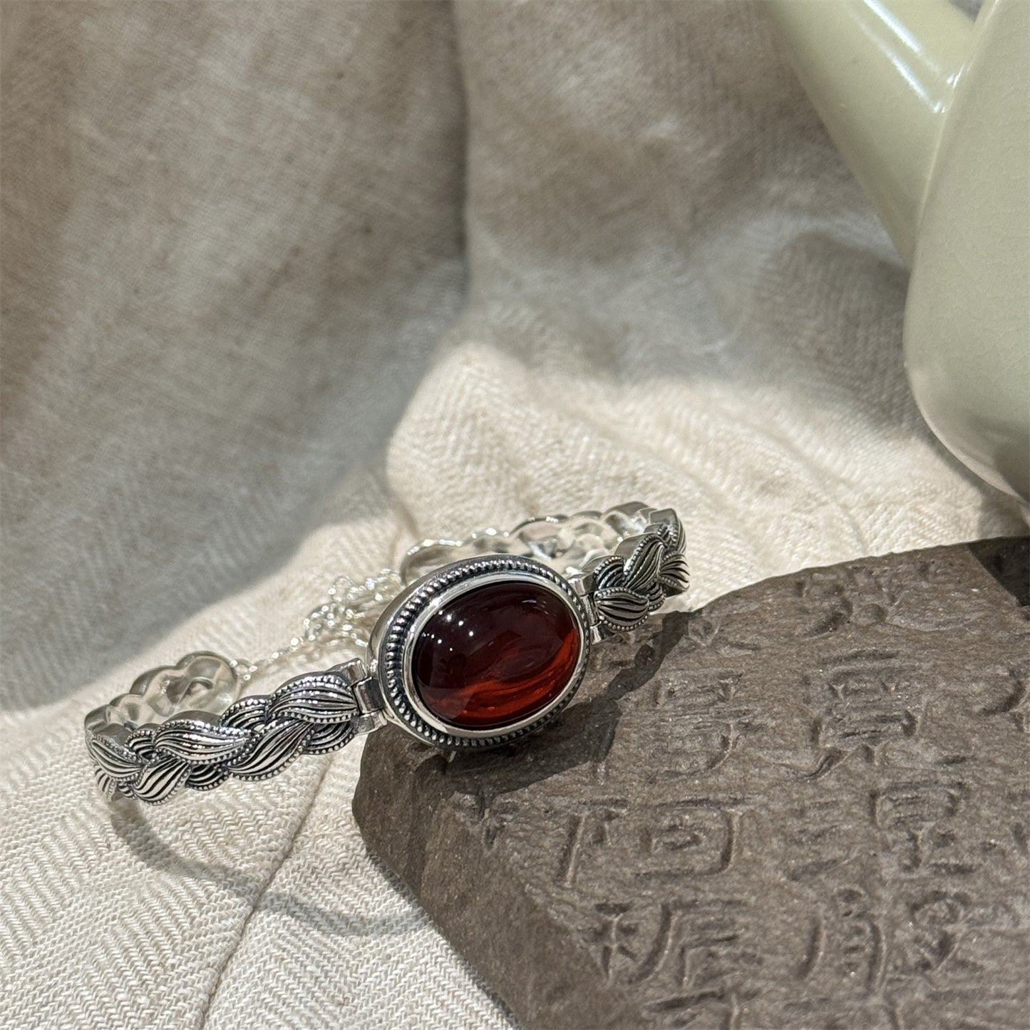 Antique Thai Silver Braided Twist Bracelet - Elegant Blood Amber Oval Cabochon, Vintage Ethnic Style Jewelry for Sophisticated Women