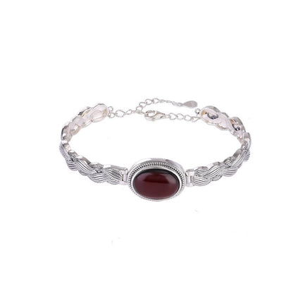 Antique Thai Silver Braided Twist Bracelet - Elegant Blood Amber Oval Cabochon, Vintage Ethnic Style Jewelry for Sophisticated Women