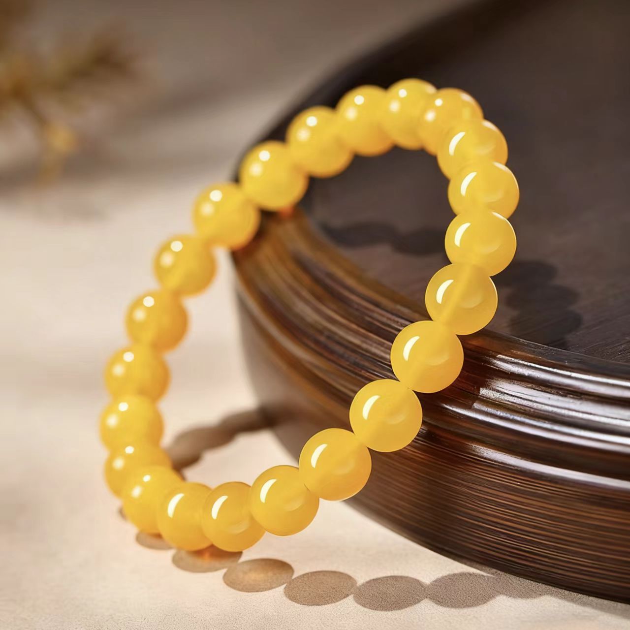 Yellow beaded bracelet on a dark surface
